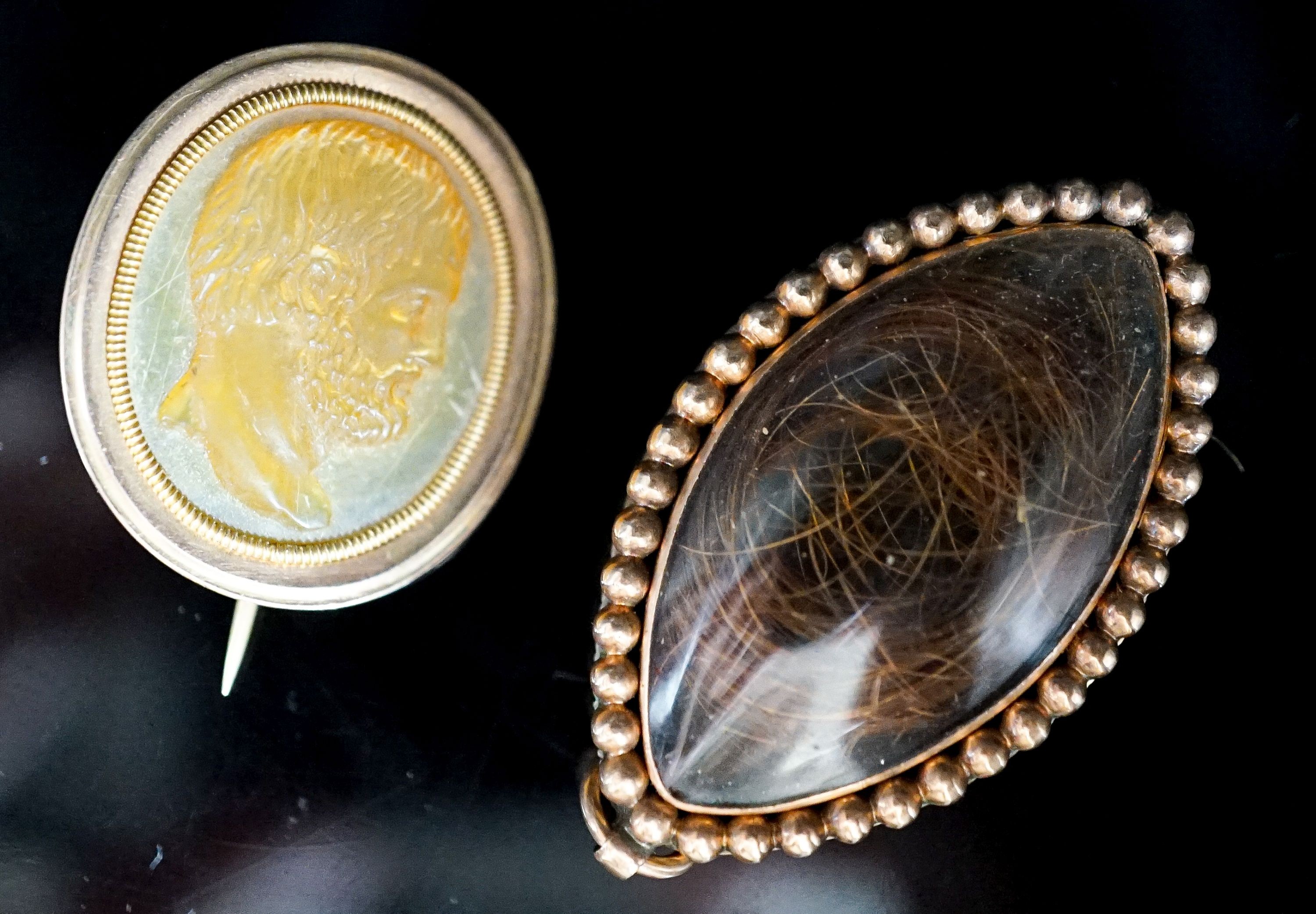A Regency seed pearl set yellow metal locket and a mother of pearl cameo brooch